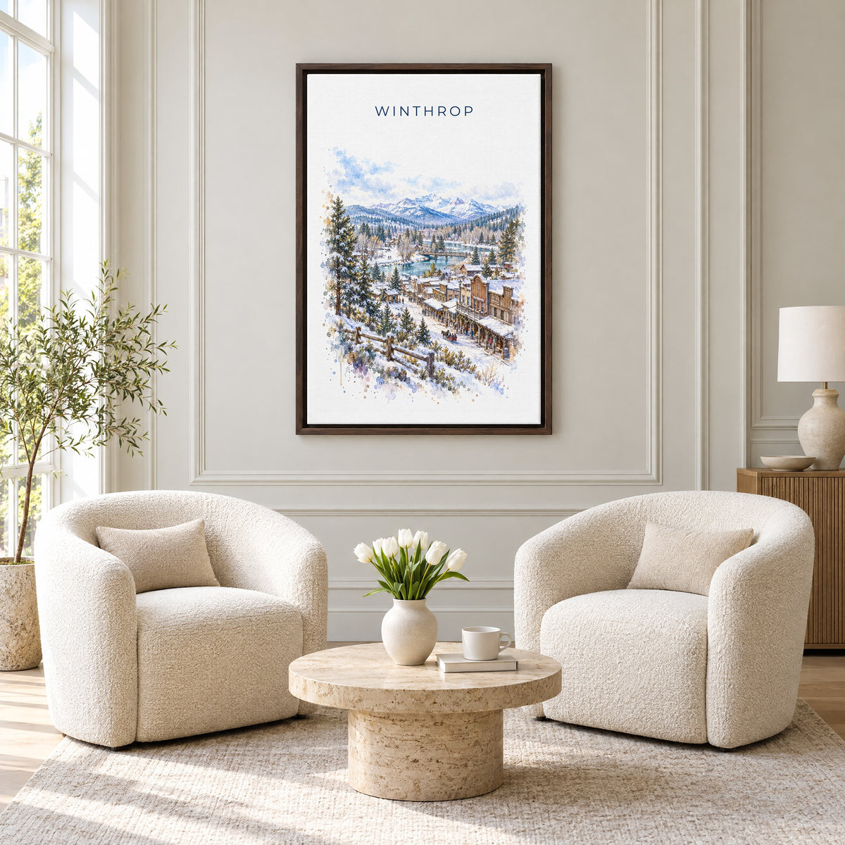 Winthrop, Washington watercolor print as an espresso floater canvas above two boucle armchairs in a hotel lounge