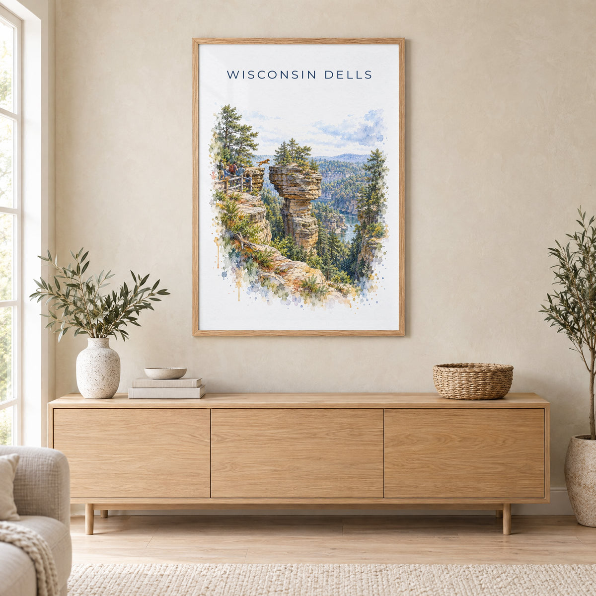 Wisconsin Dells watercolor print in an oak frame above a light wood sideboard in a Scandinavian living room