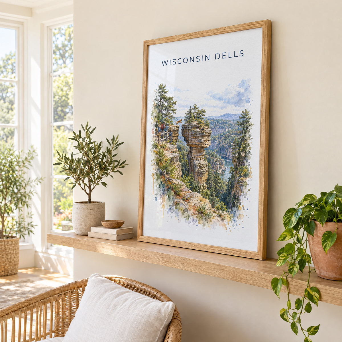 Wisconsin Dells watercolor print in an oak frame on a picture ledge in a sunlit sunroom
