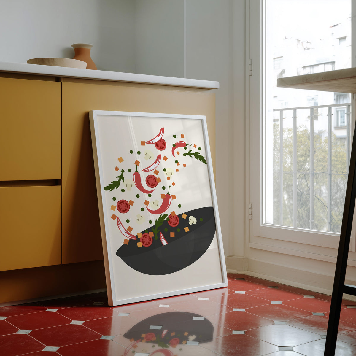 Wok toss print in a white frame against yellow cabinets on a red tiled floor