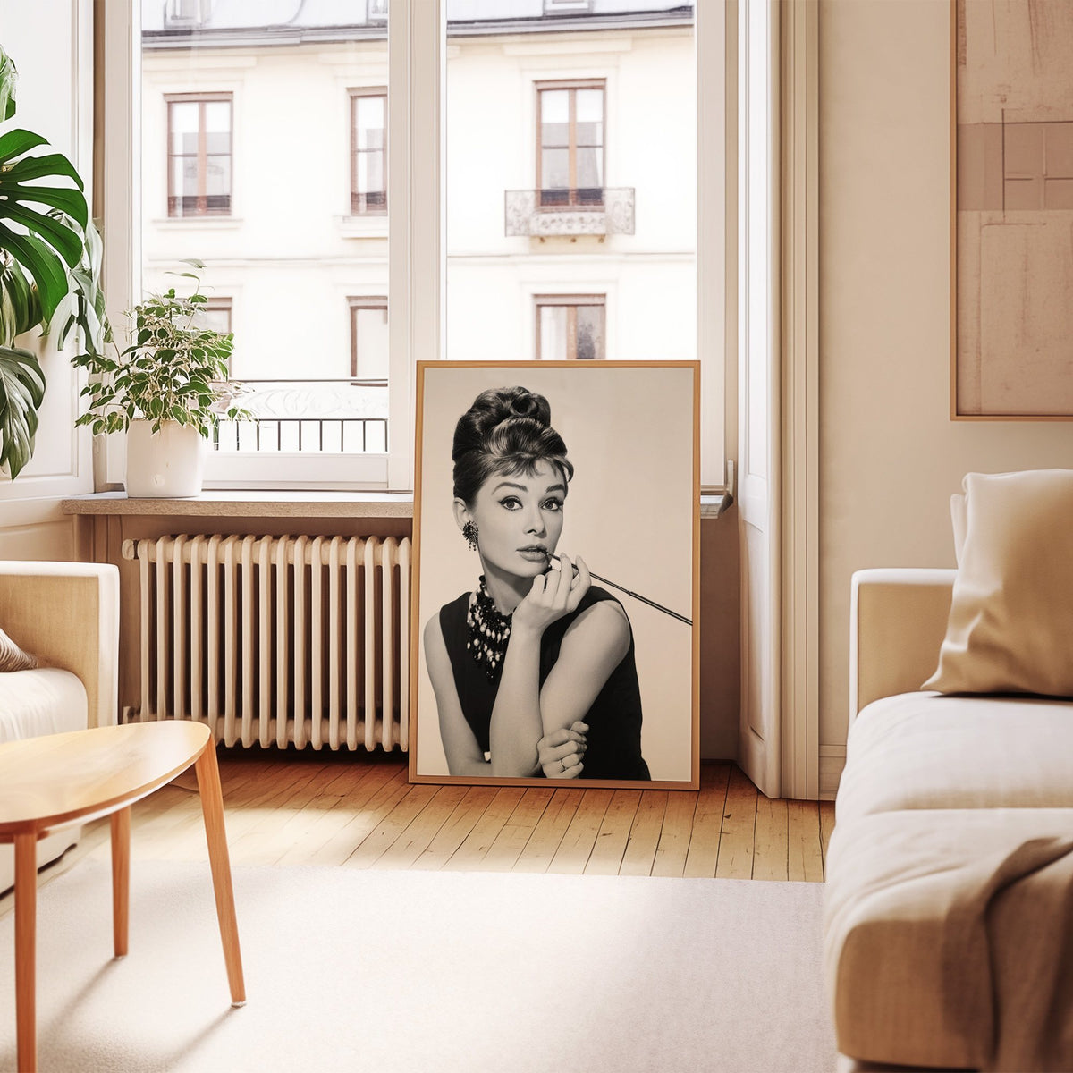Woman with updo, pearls and long cigarette holder print in an oak frame leaning by a French window in a living room