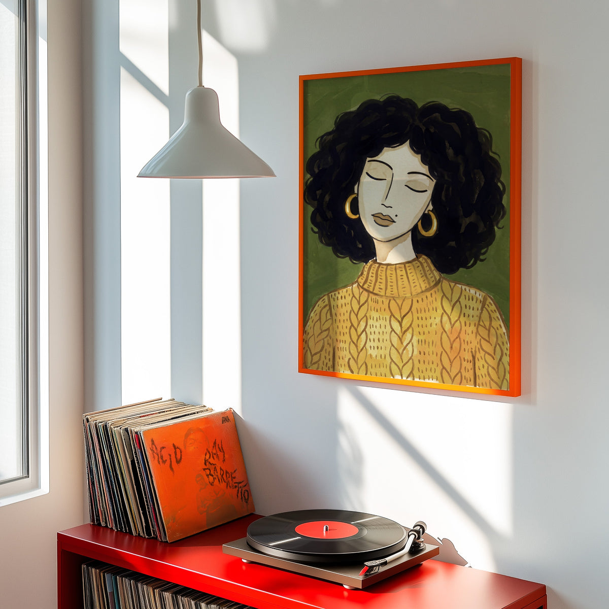 Gold hoop earrings portrait print shown in an orange frame above a red record cabinet and turntable