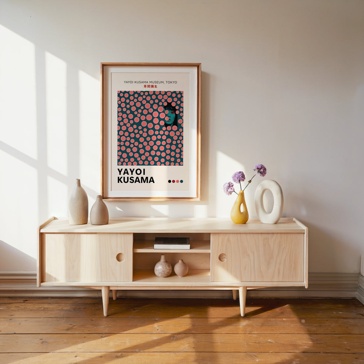 Yayoi Kusama inspired pink dots portrait print above a pale wood console