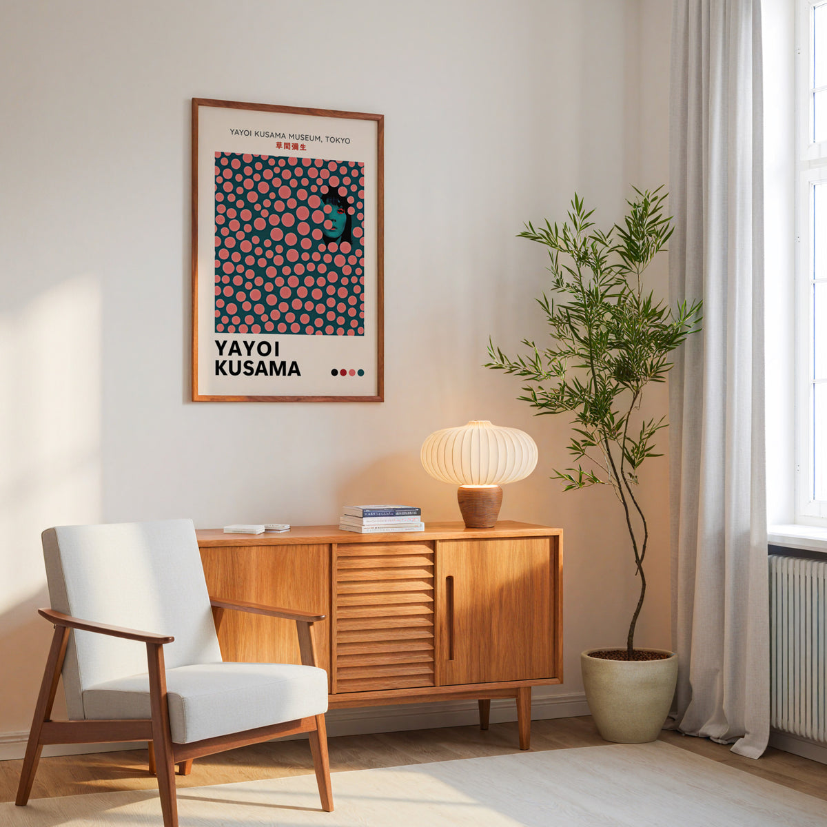 Yayoi Kusama inspired pink dots portrait print above a mid-century sideboard
