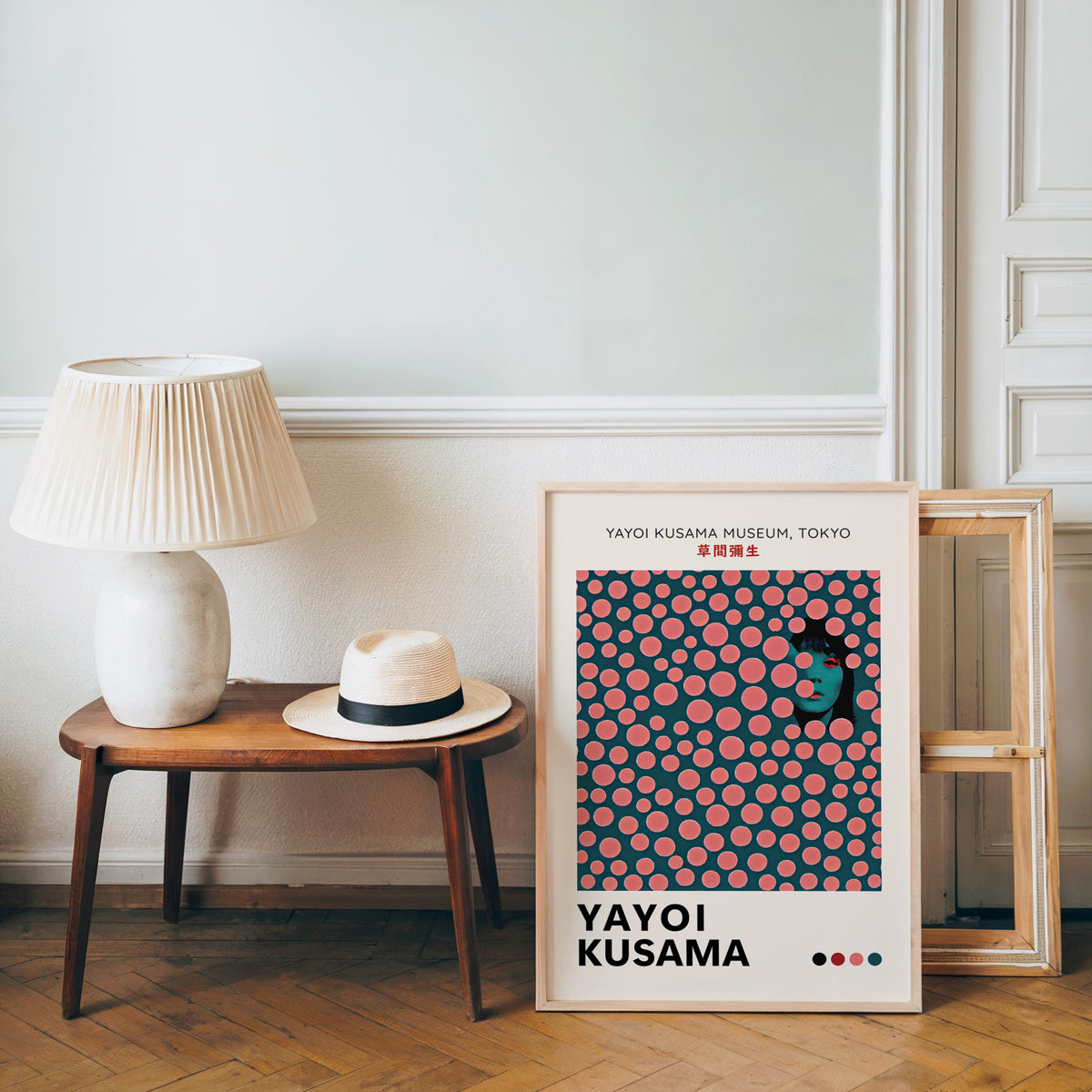Yayoi Kusama inspired pink dots portrait print beside a bench and straw hat