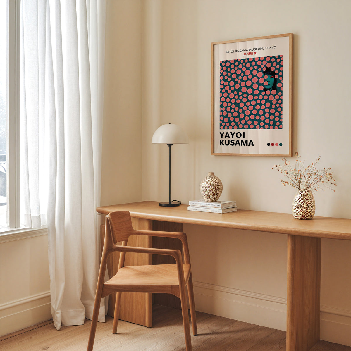 Yayoi Kusama inspired pink dots portrait print above a desk with a dome lamp