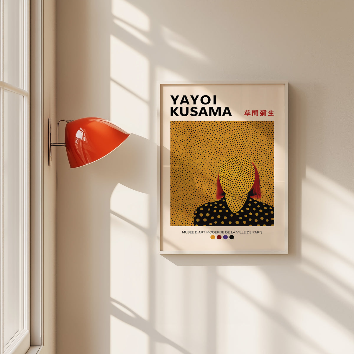Yayoi Kusama inspired gold dots portrait print in a white frame by a red wall lamp