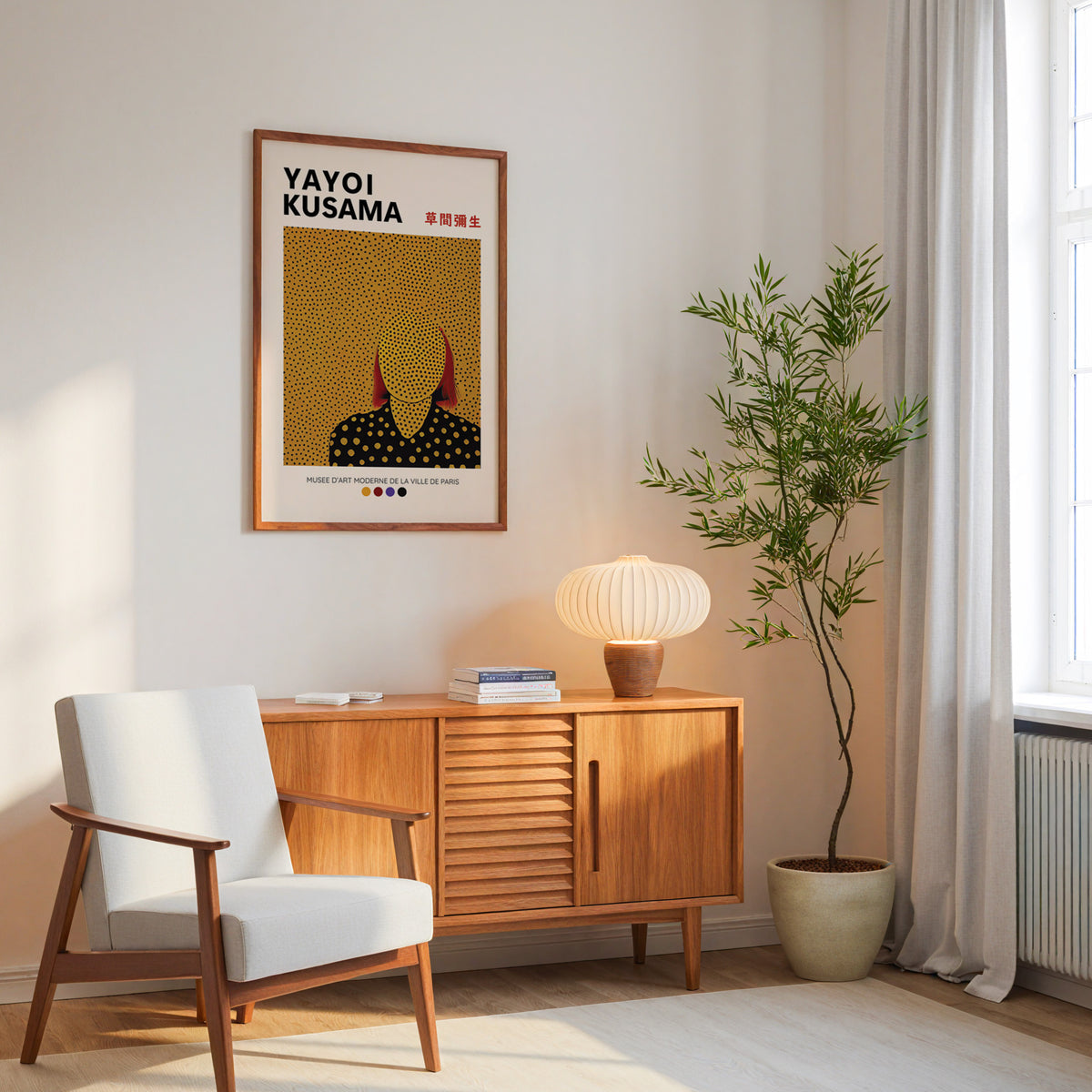 Yayoi Kusama inspired gold dots portrait print above a mid-century sideboard