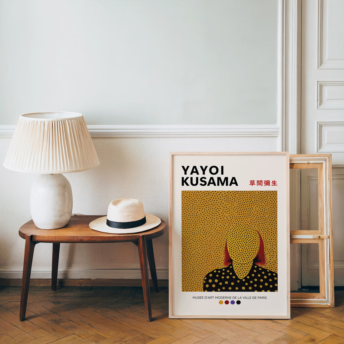 Yayoi Kusama inspired gold dots portrait print beside a bench and straw hat