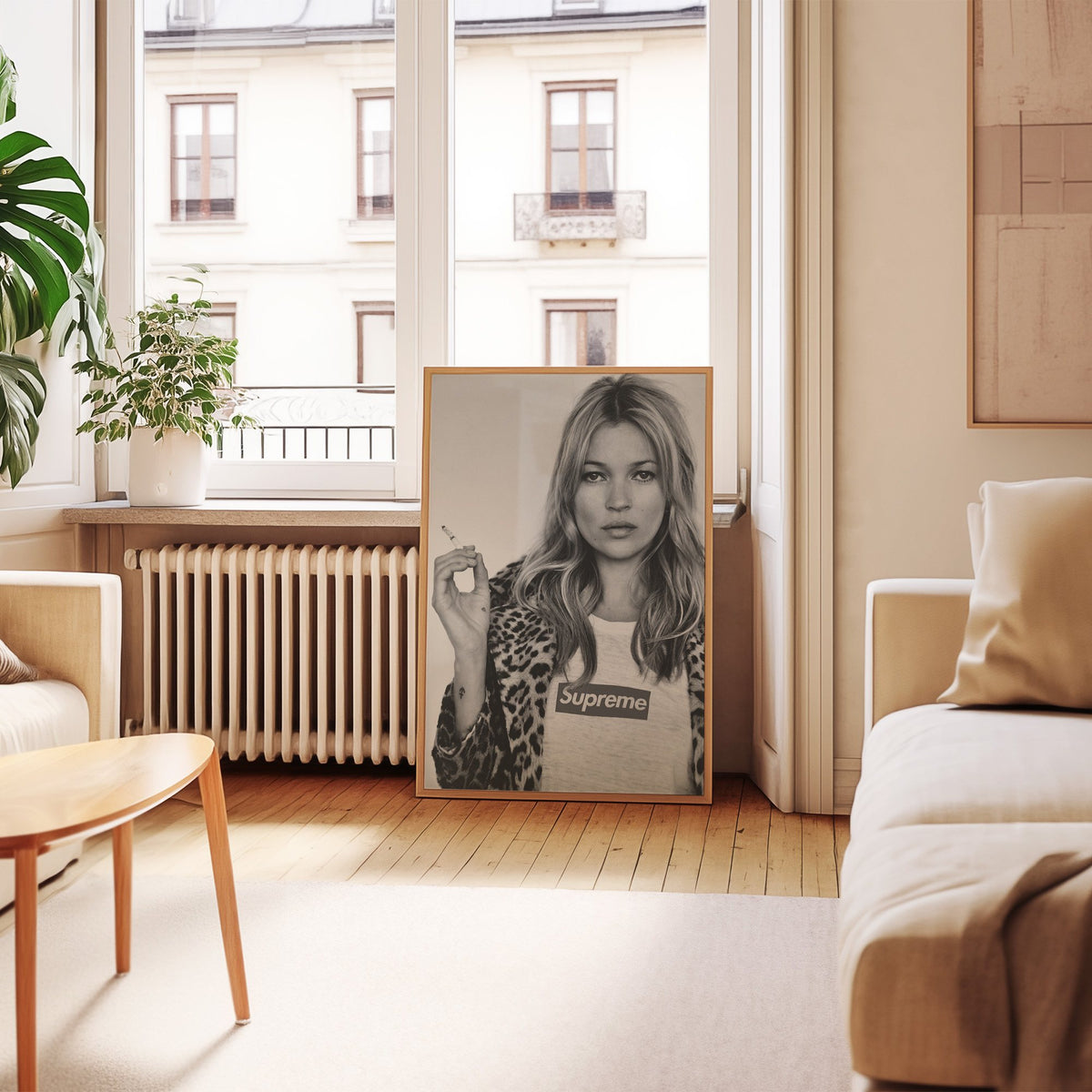 Woman in leopard coat holding a cigarette print in an oak frame leaning by a French window in a living room
