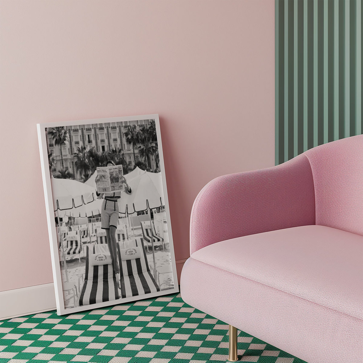 Woman in tweed suit reading a newspaper on a beach print in a white frame beside a pink armchair on a checkered floor