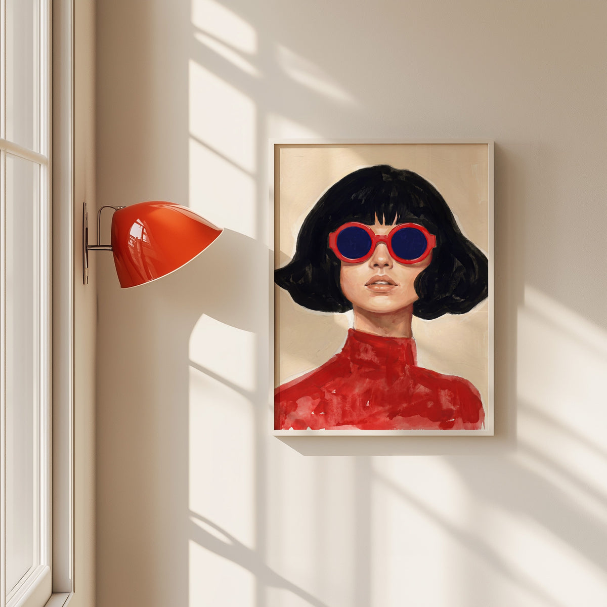 Woman in red round sunglasses print in a white frame beside a red wall sconce