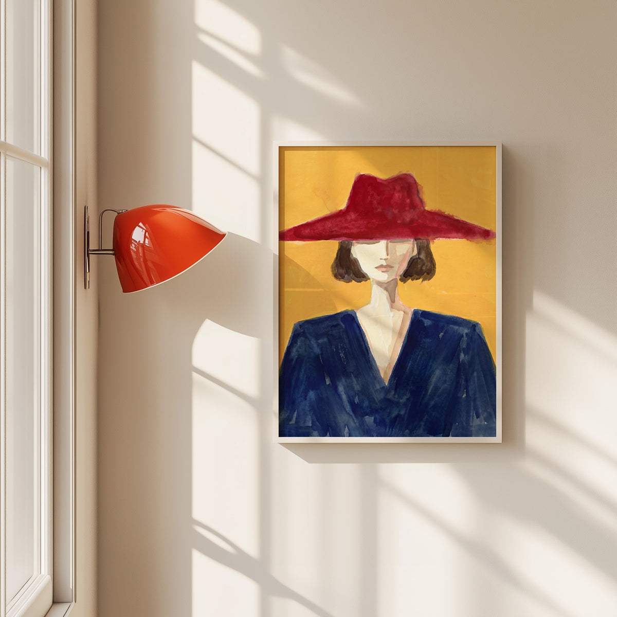 Woman in red wide brim hat print in a white frame beside a red wall sconce