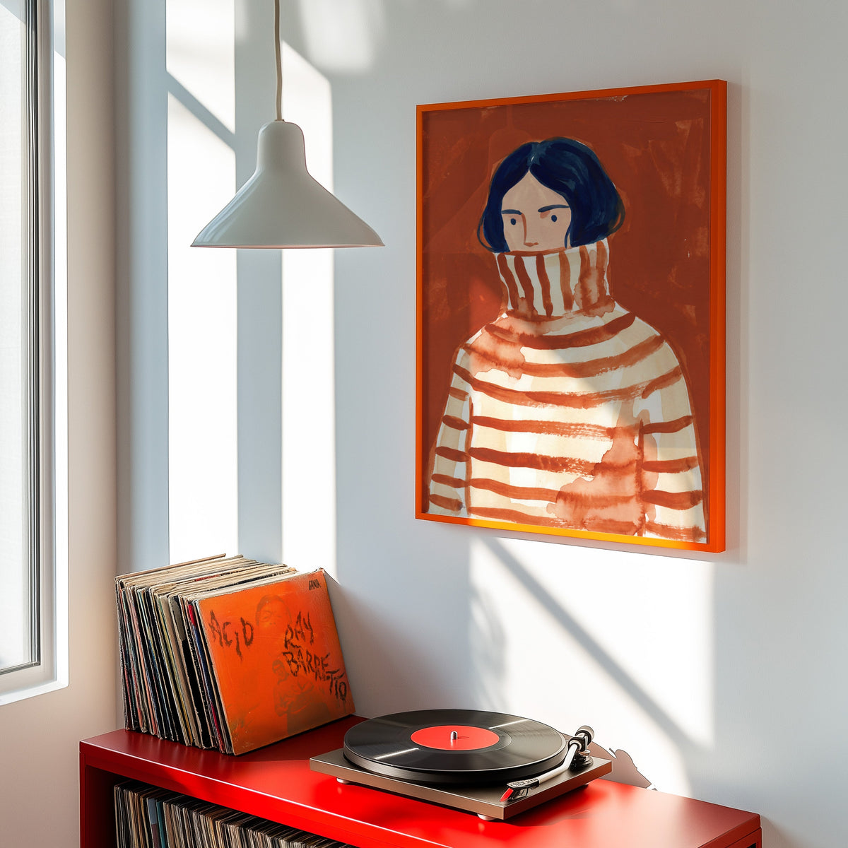 Navy bob portrait print shown in an orange frame above a red record cabinet and turntable