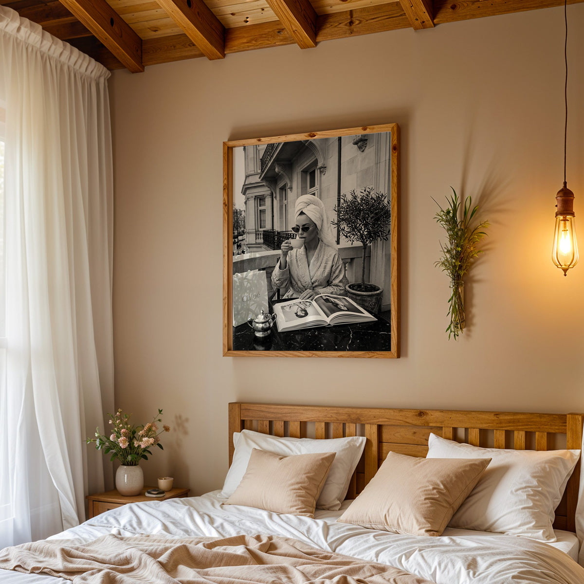 Woman in towel turban drinking coffee on balcony print in a pine frame above a wood headboard bed under a pendant bulb