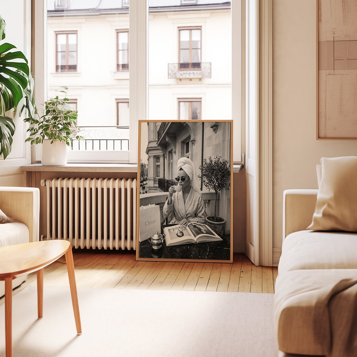 Woman in towel turban drinking coffee on balcony print in an oak frame leaning by a French window in a living room