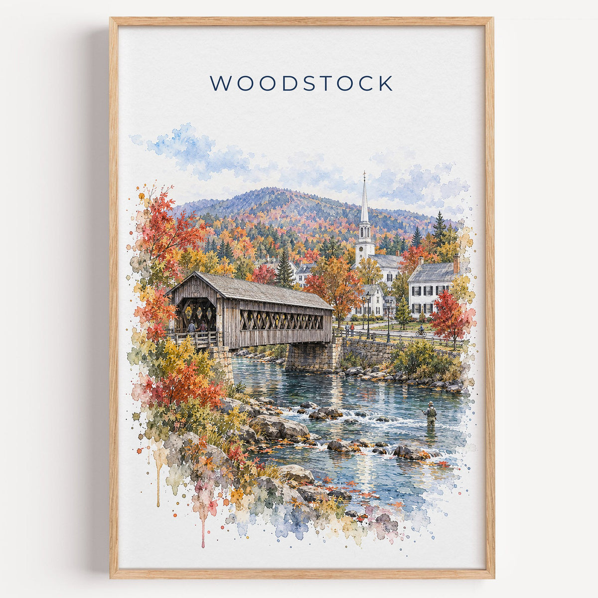 Woodstock, Vermont watercolor print in a light oak frame on a plain white wall
