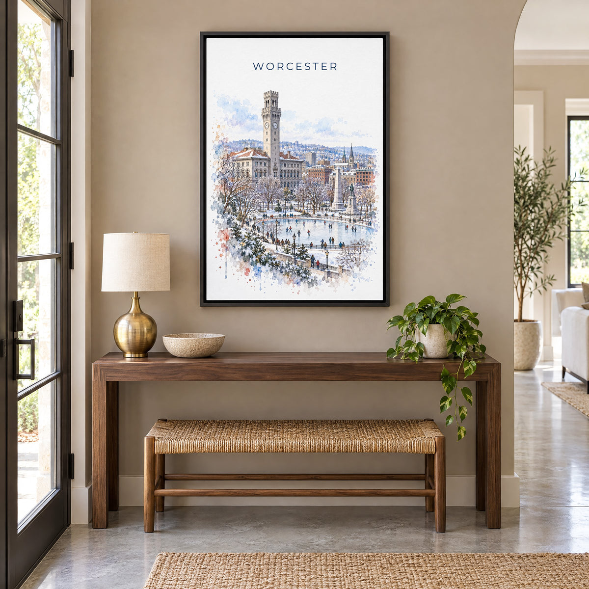 Worcester, Massachusetts watercolor print as a black floater canvas above a walnut console and woven bench in an entryway