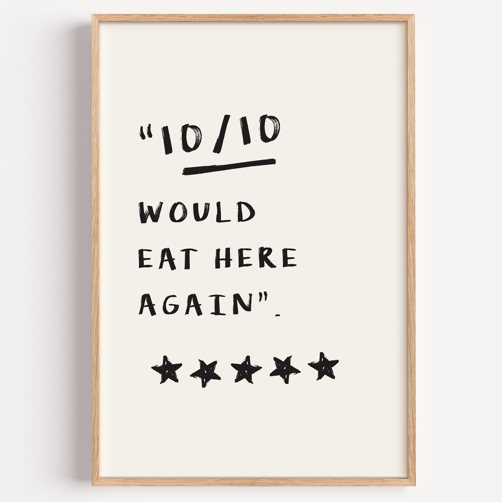 Would eat here again print in a light oak frame on a plain white wall