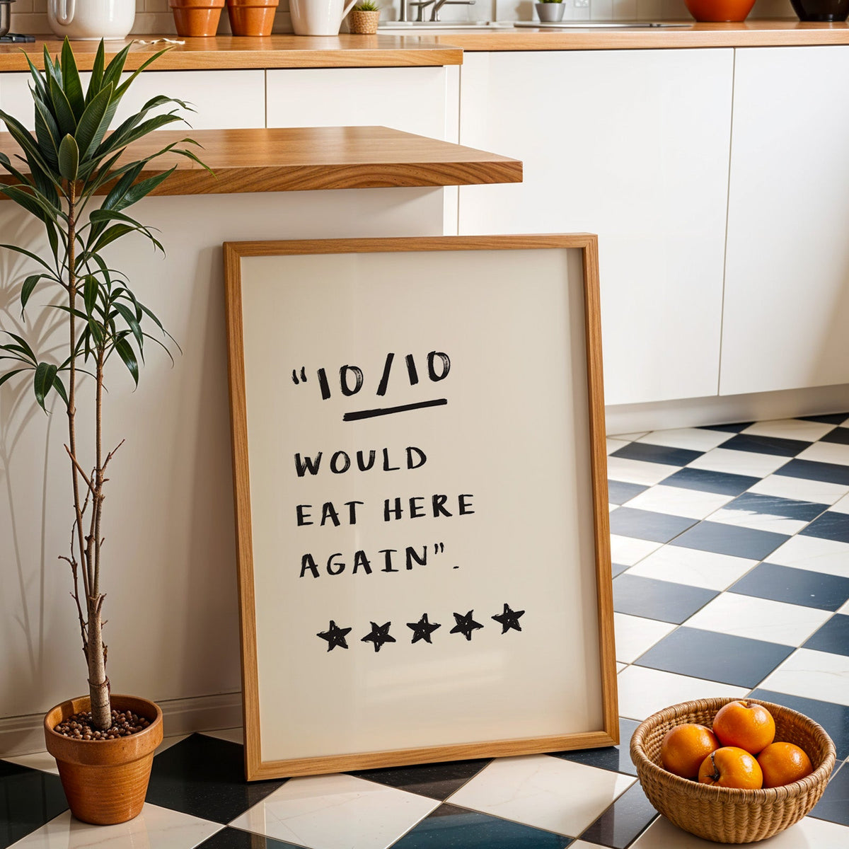 Would eat here again print in an oak frame by a kitchen island and checkered floor