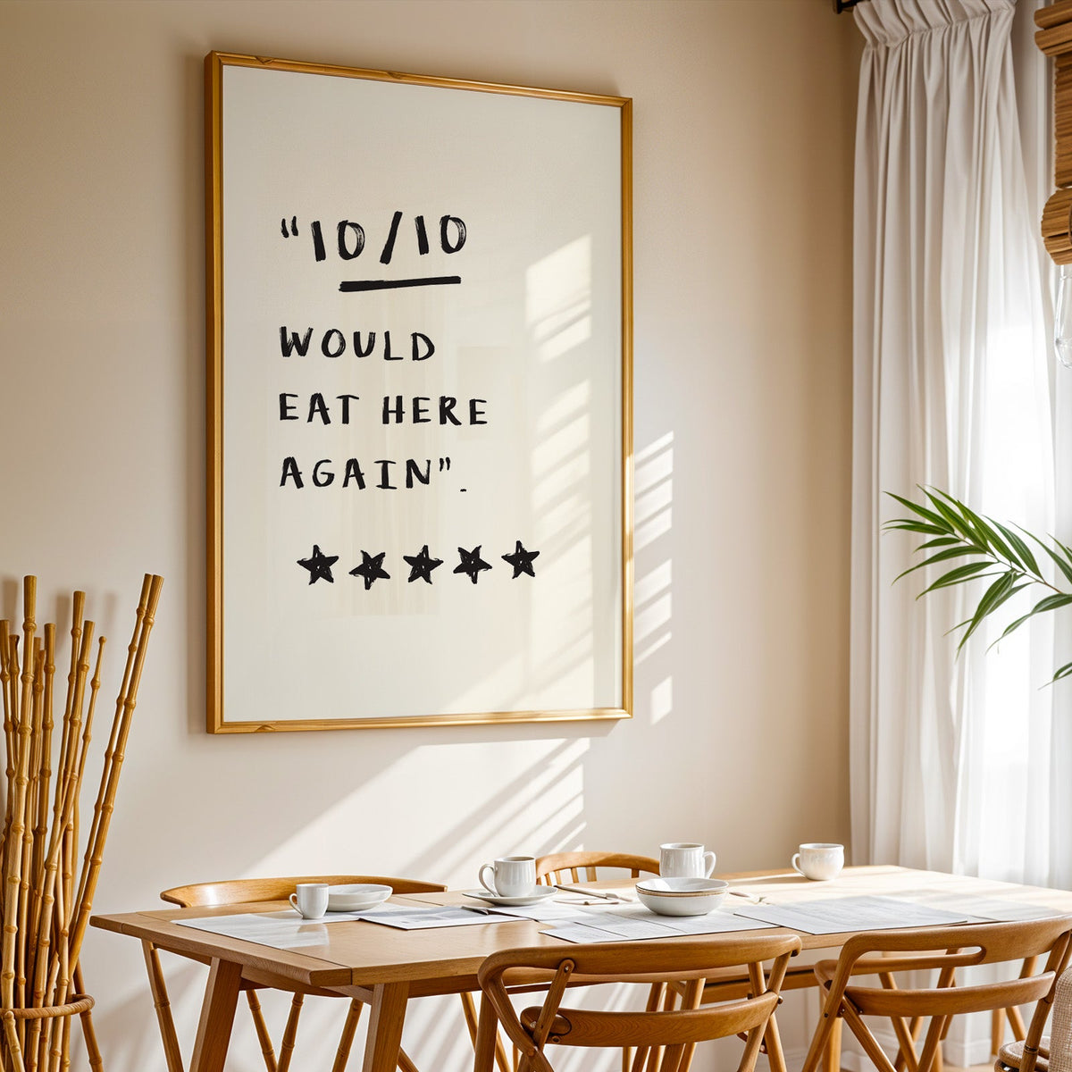 Would eat here again print in a gold frame above a sunlit breakfast table