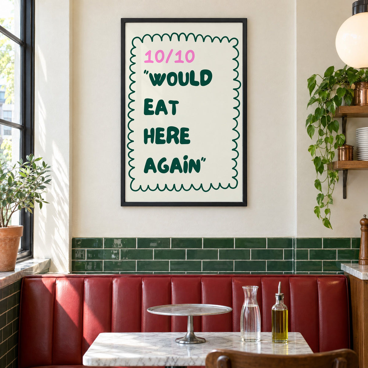 Would Eat Here Again 10/10 print in a black frame above a red leather booth in a sunny pizzeria