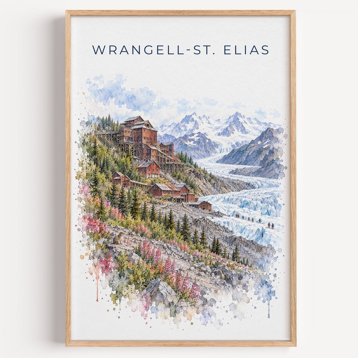 Wrangell-St. Elias National Park watercolor print in a light oak frame on a plain white wall