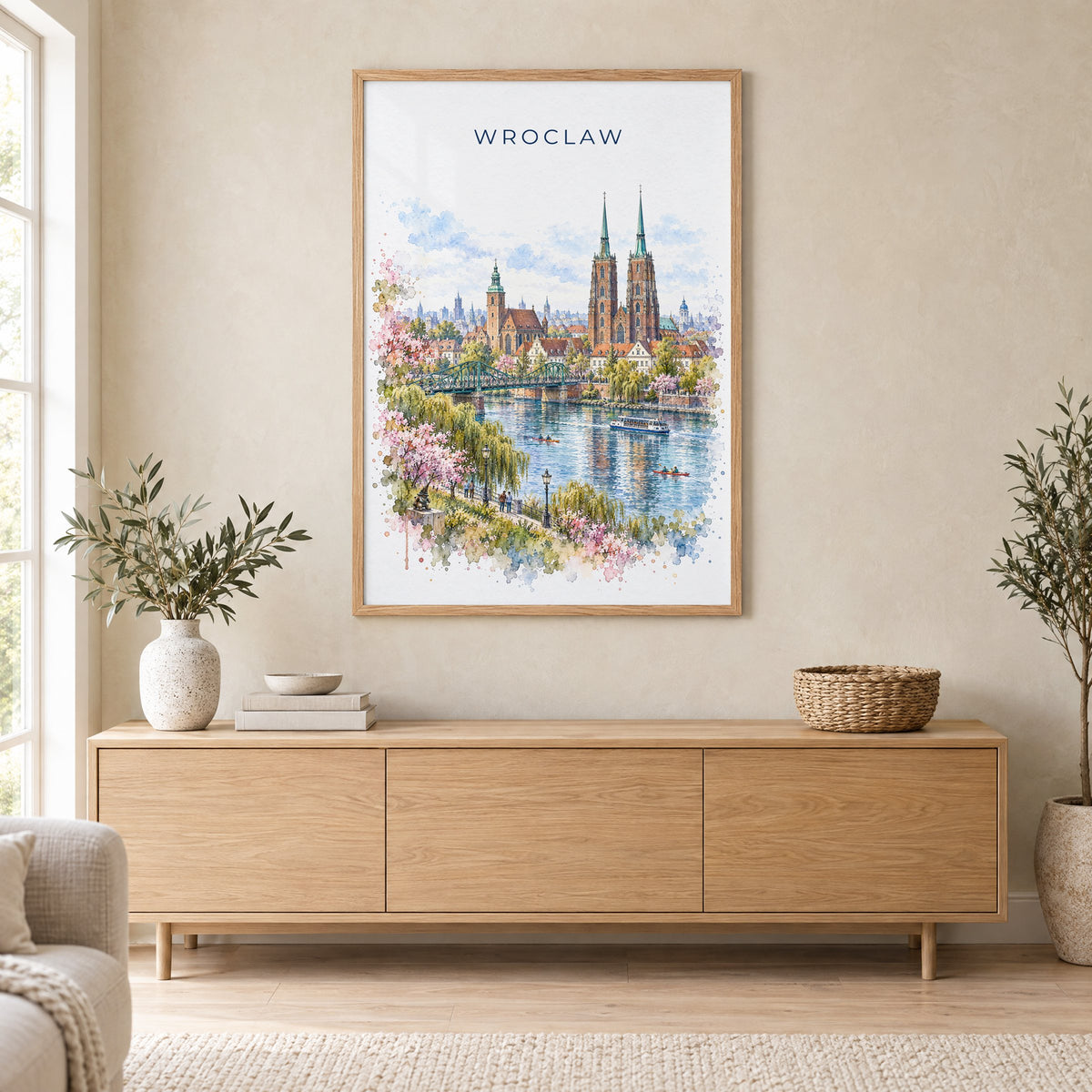 Wroclaw watercolor print in an oak frame above a light wood sideboard in a Scandinavian living room