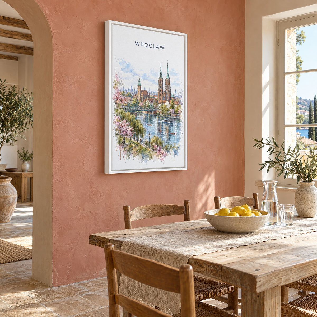 Wroclaw watercolor print as a white floater canvas on a terracotta wall above a rustic dining table