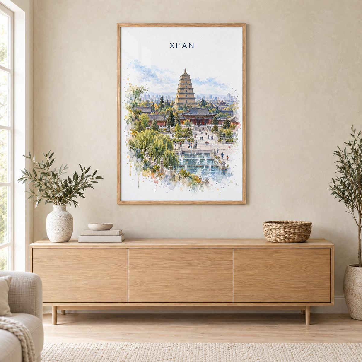 Xi'an watercolor print in an oak frame above a light wood sideboard in a Scandinavian living room