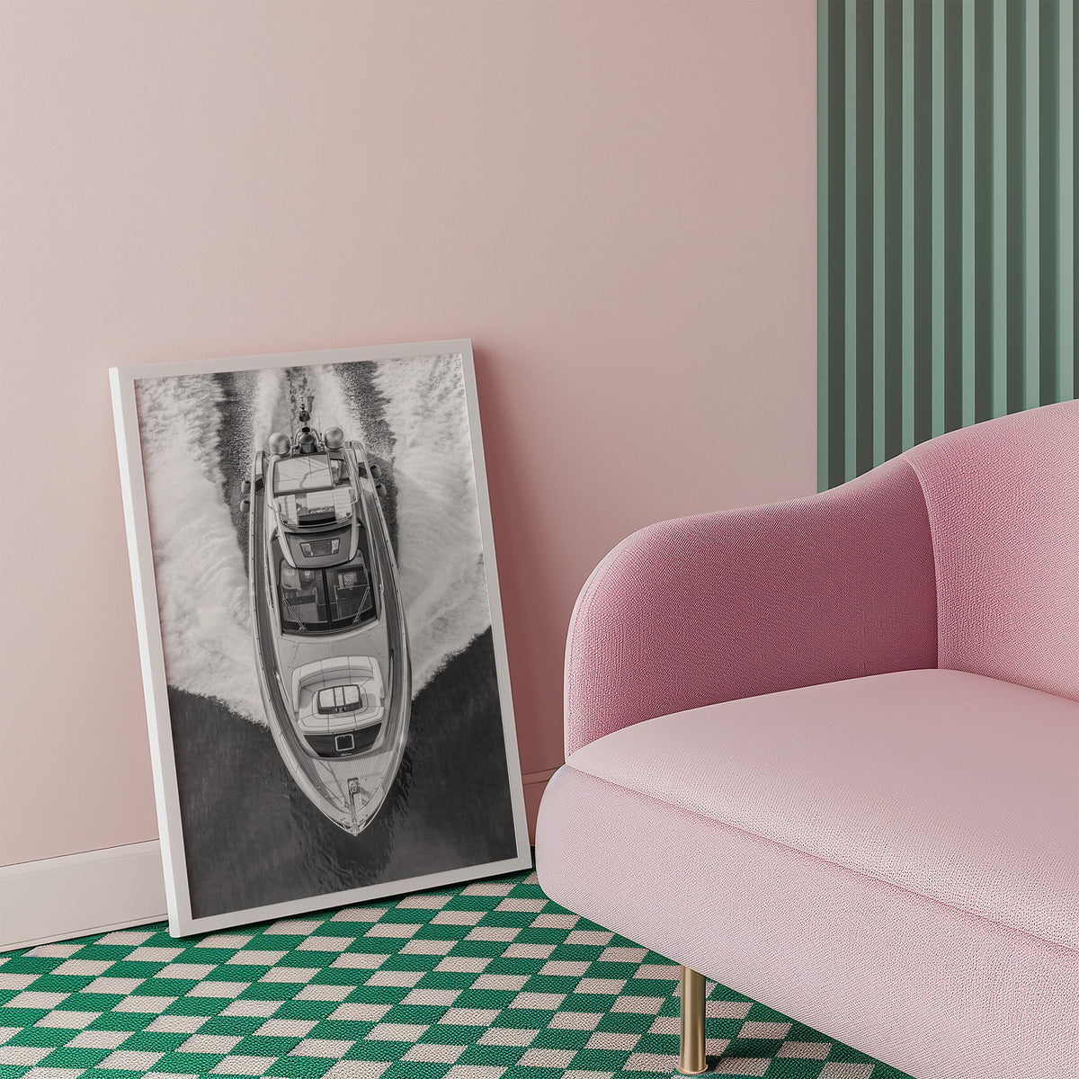 Aerial view of a yacht with white wake print in a white frame beside a pink armchair on a checkered floor