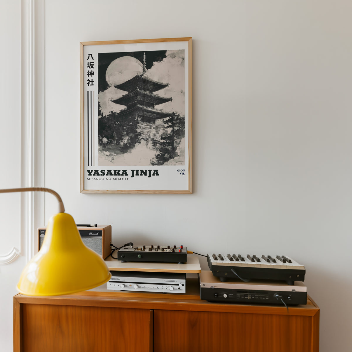 Sumi-e Yasaka pagoda and full moon print in an oak frame above a teak sideboard with vintage hi-fi