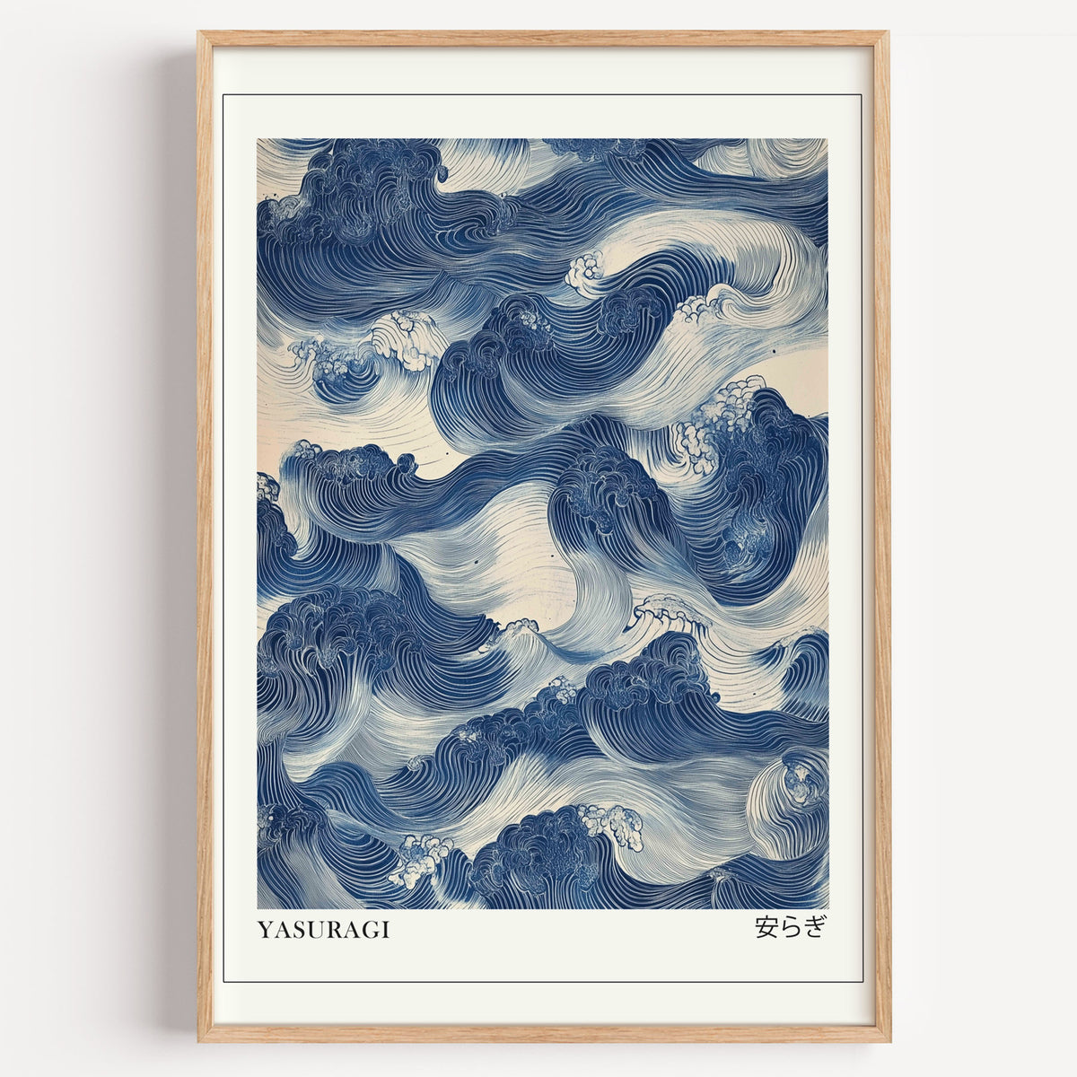 Indigo woodblock Yasuragi waves print in a light oak frame on a plain white wall