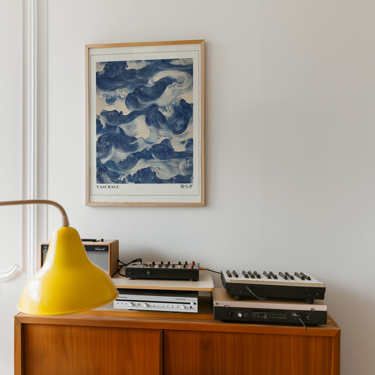 Indigo woodblock Yasuragi waves print in an oak frame above a teak sideboard with vintage hi-fi
