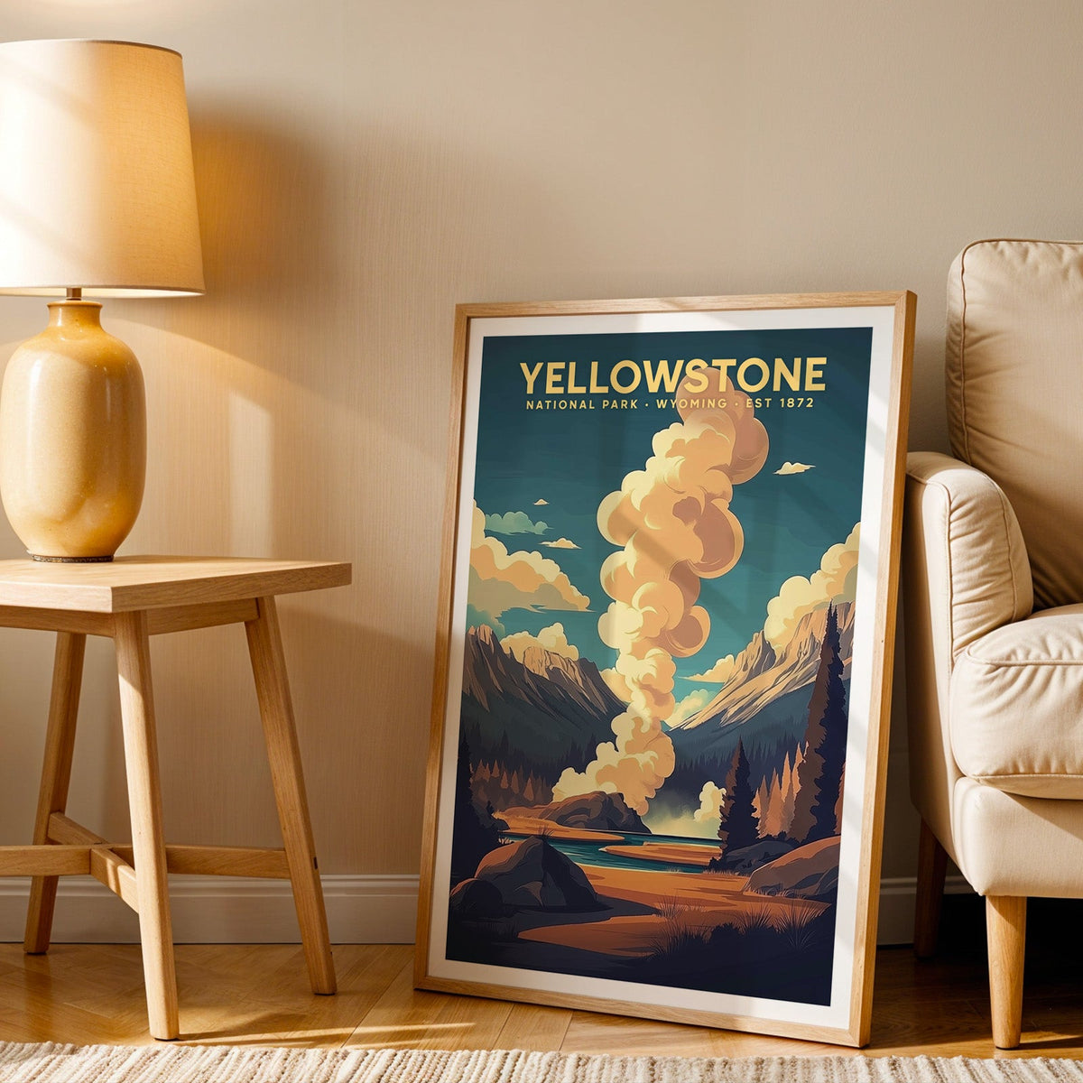 Yellowstone print in an oak frame beside a cream armchair and an amber lamp in warm afternoon light