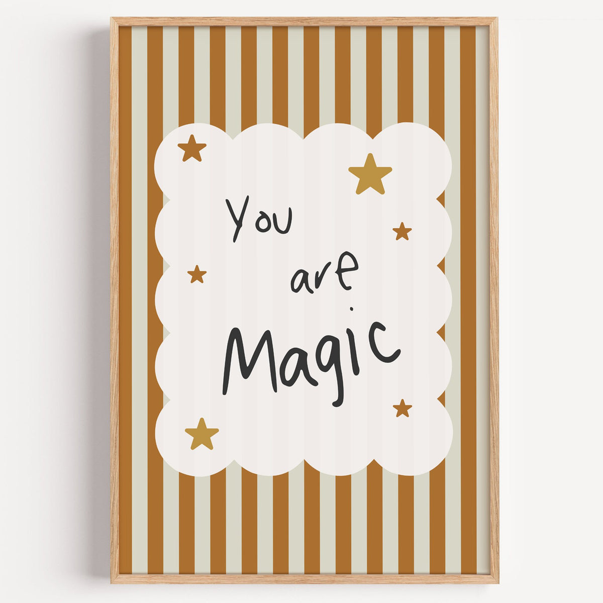 You are magic stars nursery print in a light oak frame on a plain white wall