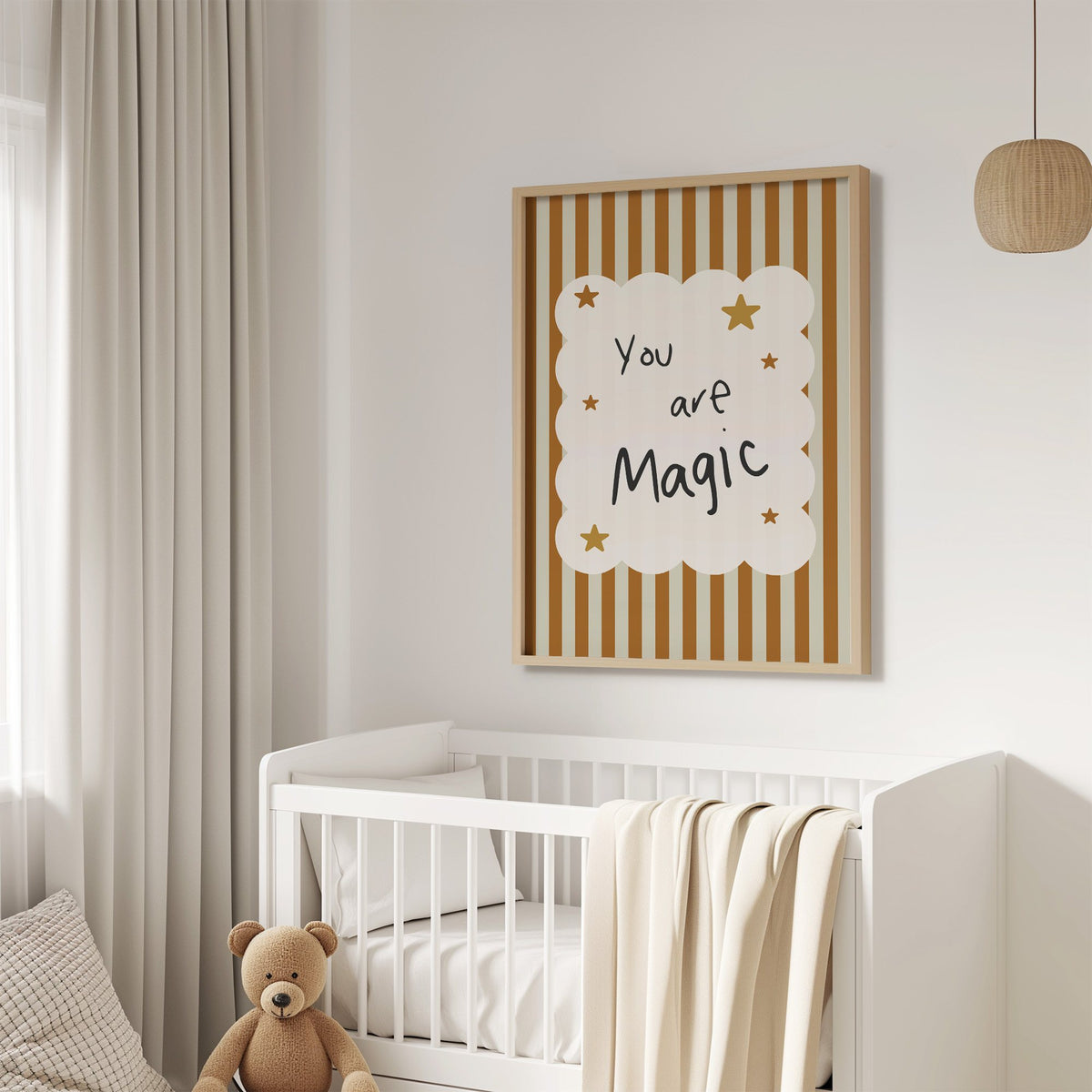 You are magic stars nursery print in an oak frame above a white crib with a teddy bear
