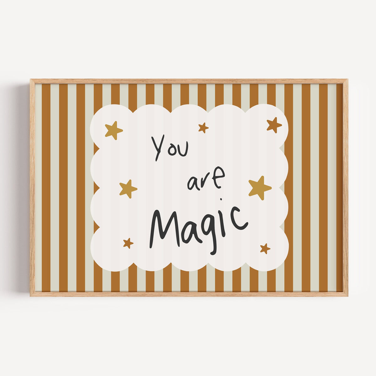 Landscape you are magic stars nursery print in a light oak frame on a plain white wall