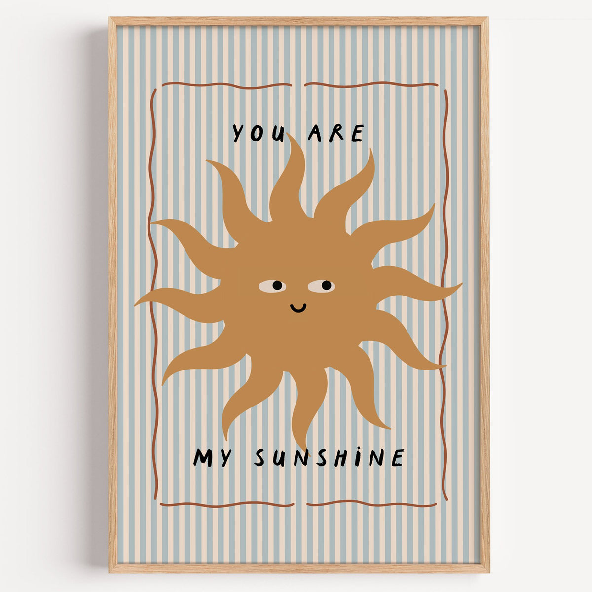 You are my sunshine sun nursery print in a light oak frame on a plain white wall