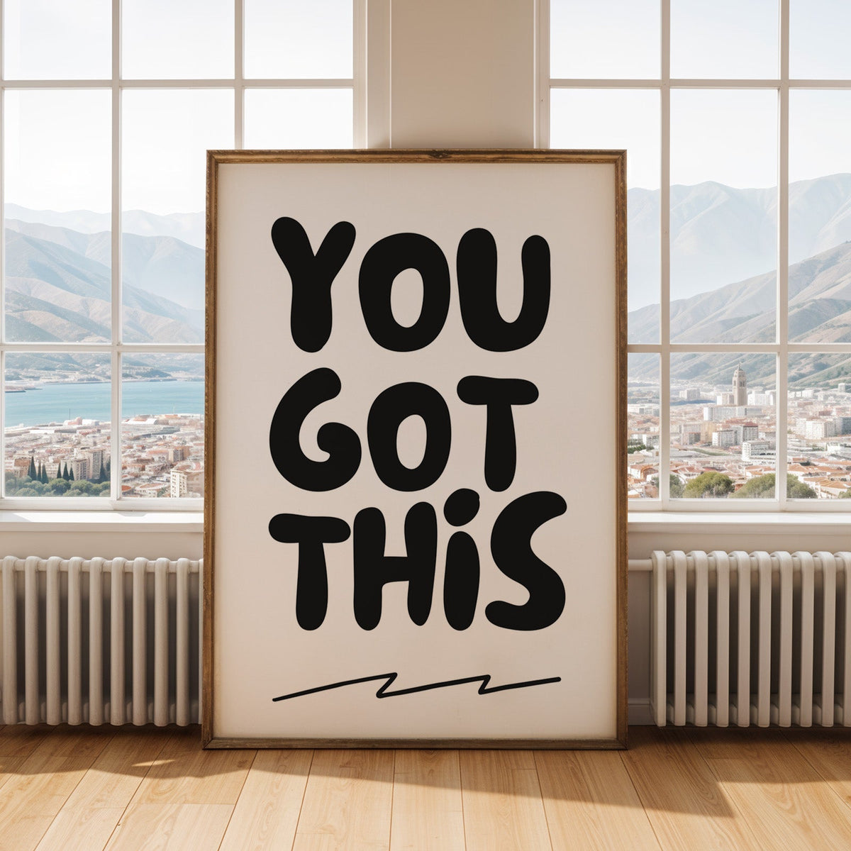 You got this bubble letter quote print shown in an antique gold frame by tall windows with a sea view