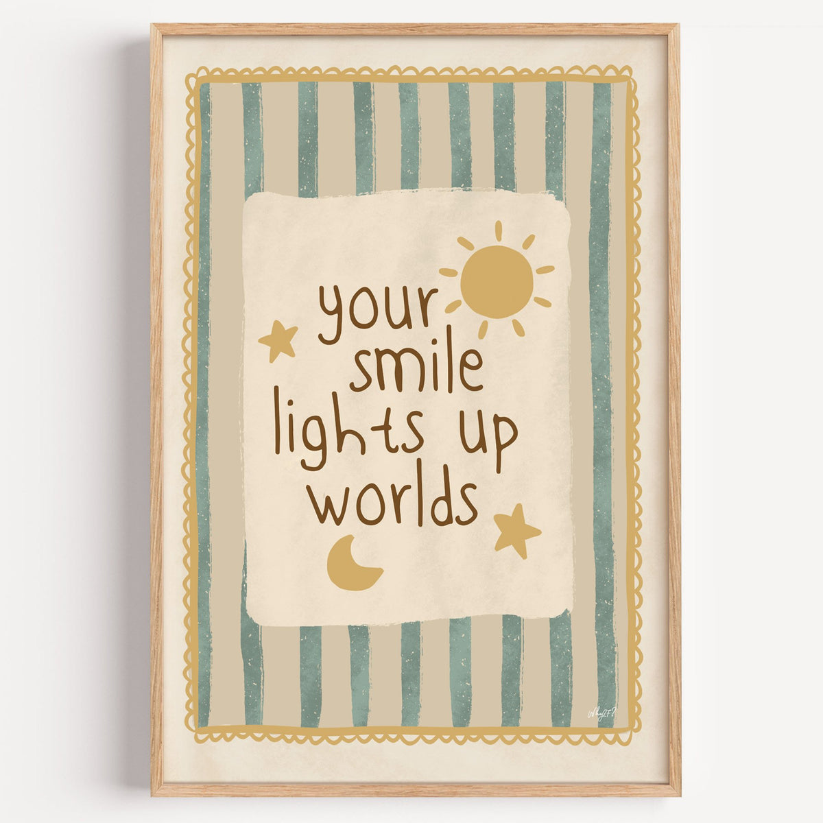 Your smile lights up worlds nursery print in a light oak frame on a plain white wall
