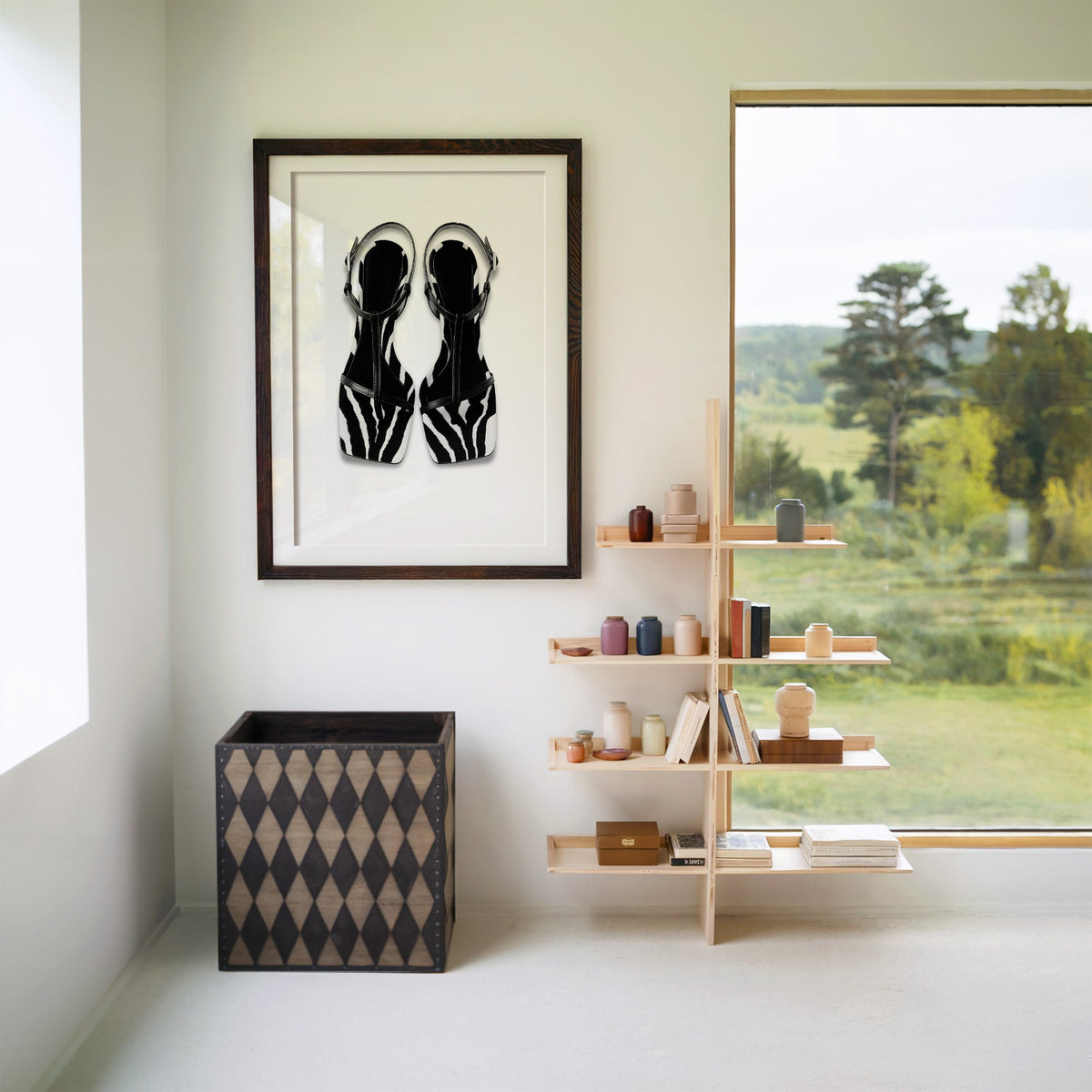 Zebra stripe T-strap sandals on white print in a walnut frame with a white mat beside wooden shelves and a garden window