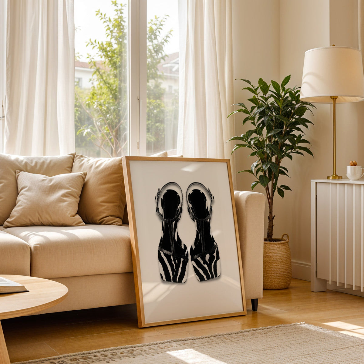 Zebra stripe T-strap sandals on white print in a light oak frame leaning on a cream sofa beside a floor lamp