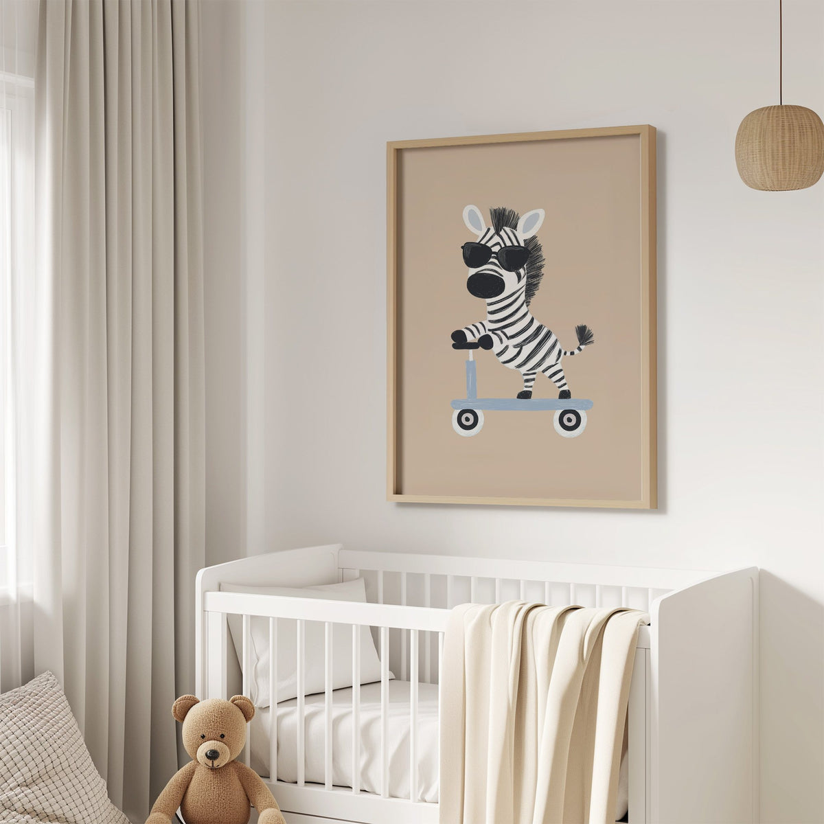 Zebra in sunglasses on scooter nursery print in an oak frame above a white crib with a teddy bear
