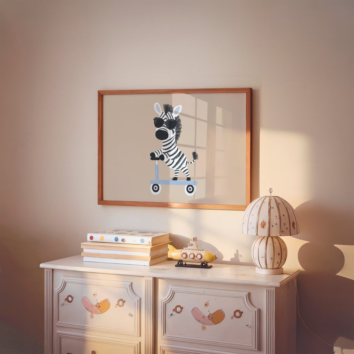Landscape zebra in sunglasses on scooter nursery print in a cherry wood frame above a painted dresser and lamp
