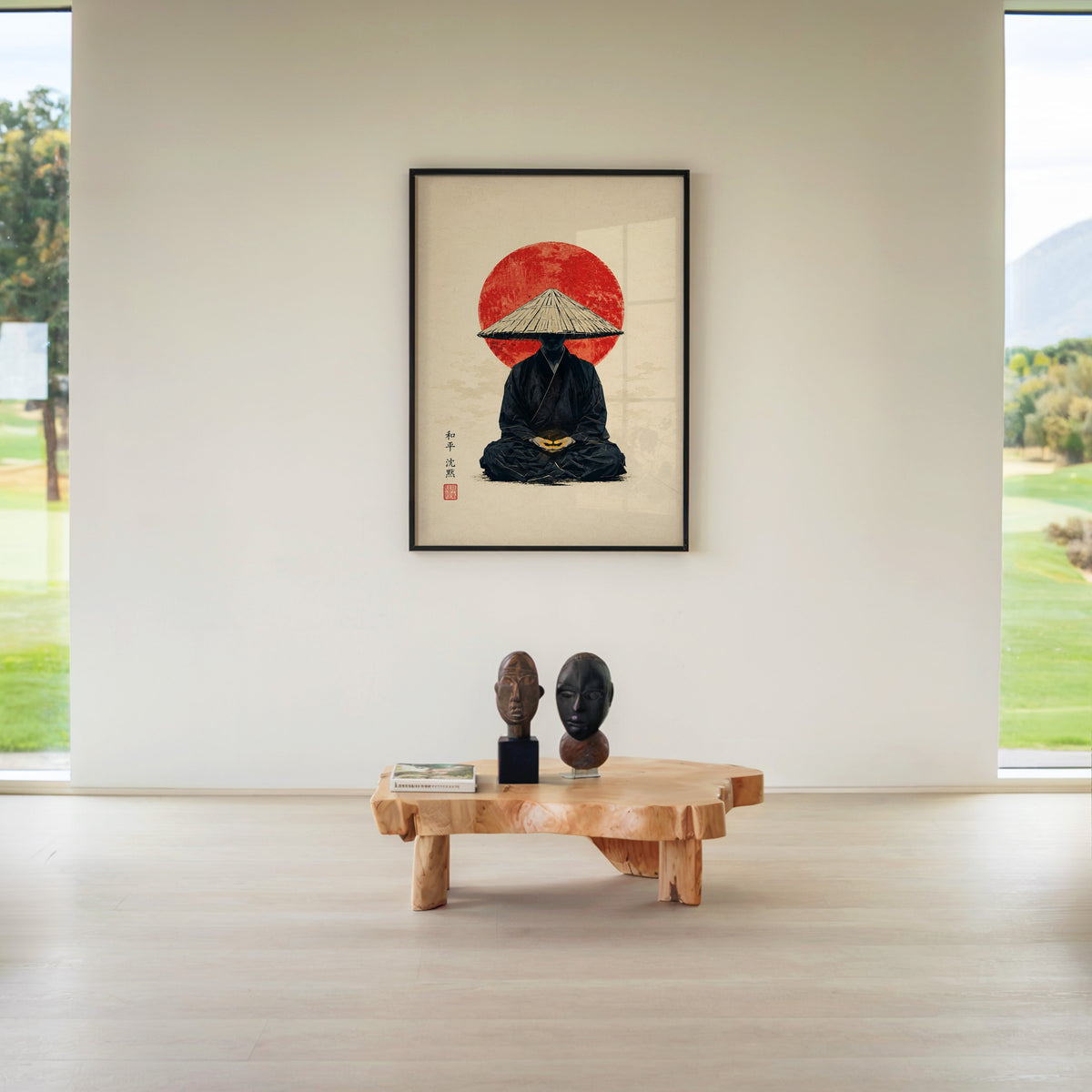 meditating monk in straw hat with red sun print in a black frame above a live-edge wood coffee table between garden windows