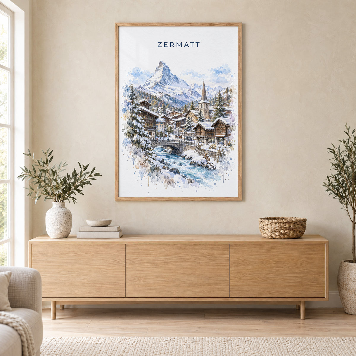 Zermatt watercolor print in an oak frame above a light wood sideboard in a Scandinavian living room