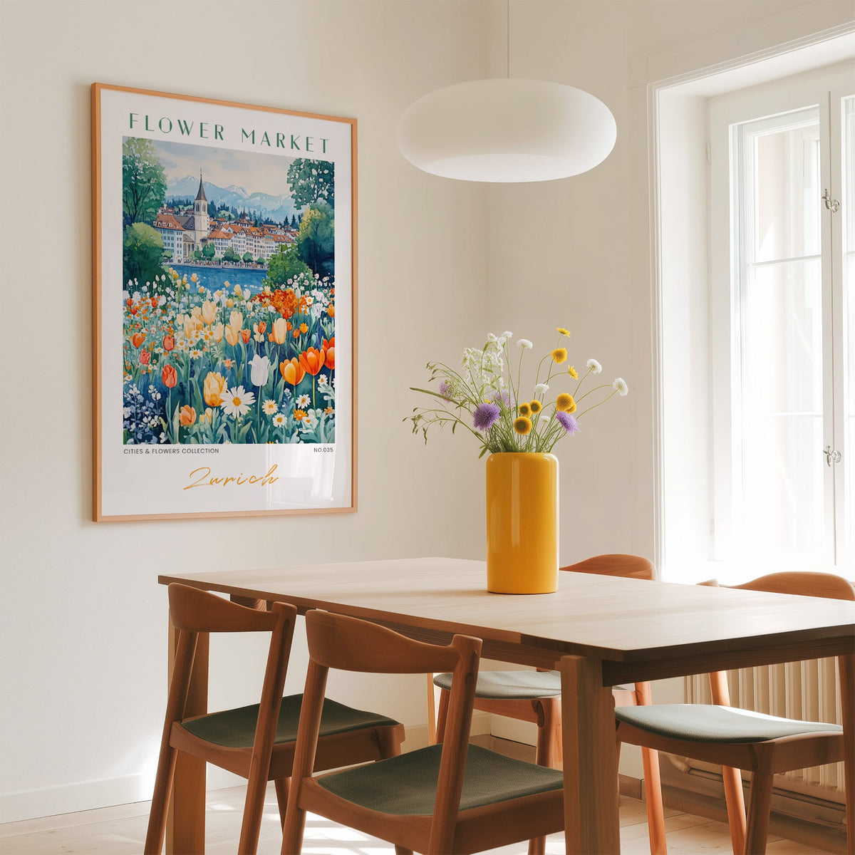 Zurich flower market print in an oak frame above a dining table with a yellow vase and white pendant light