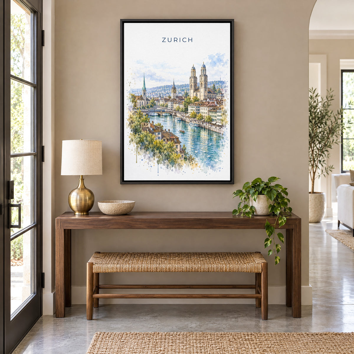 Zurich watercolor print as a black floater canvas above a walnut console and woven bench in an entryway